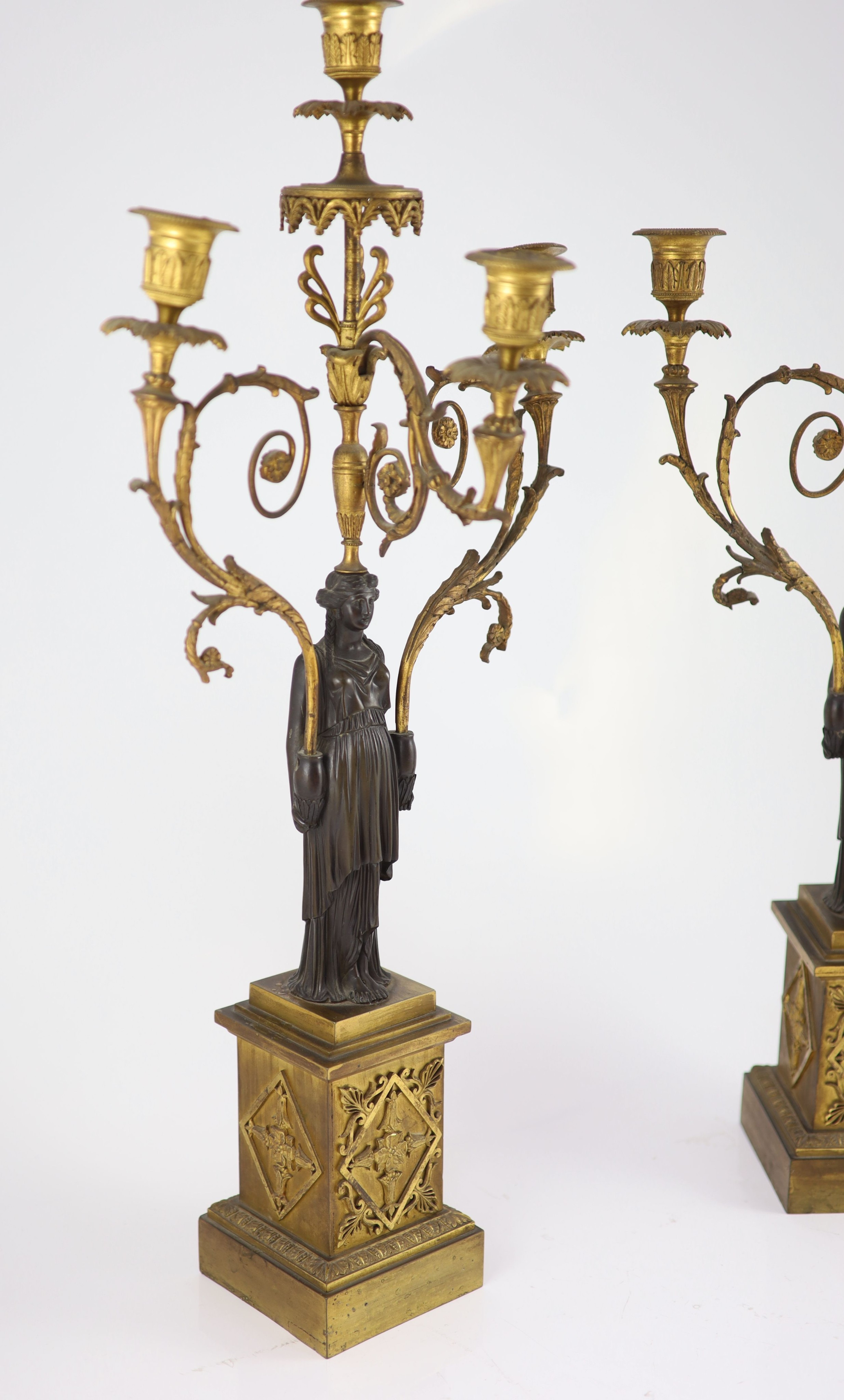 A pair of 19th-century French bronze and ormolu candelabra H 68cm. W 32cm.